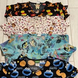 Lot of 4 character scrubs size M